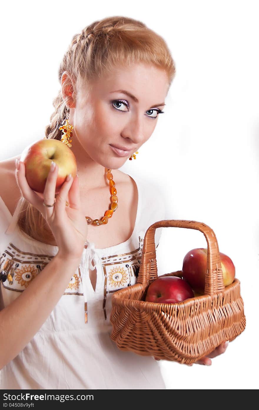 Redheaded woman with basket of apples over white