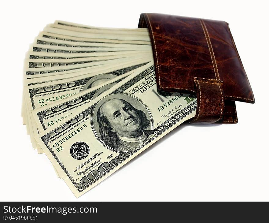 Banknotes of 100 US dollars in leather purse on a white background. Banknotes of 100 US dollars in leather purse on a white background