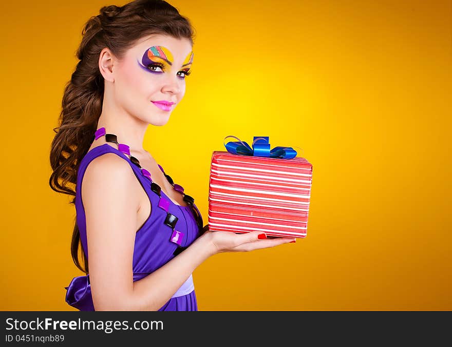 Beautiful Woman With Make Up In Dress With A Gift