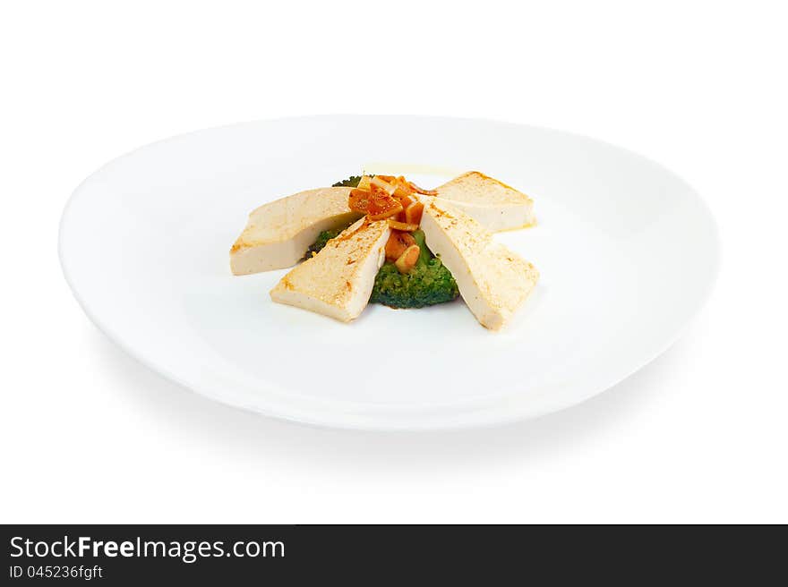 Slices of fried cheese with grilled vegetables on a white background