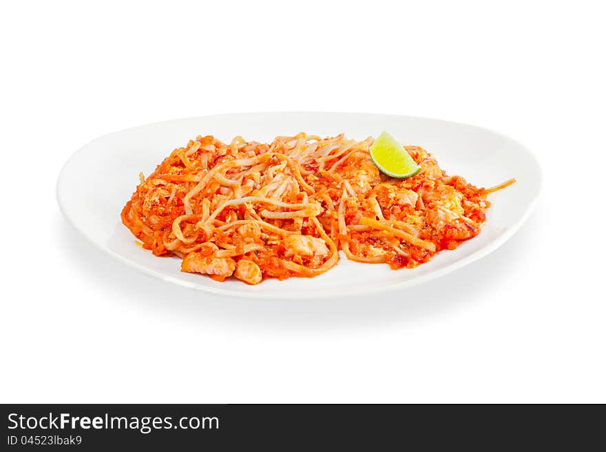 Spaghetti with seafood and tomato sauce on a white background