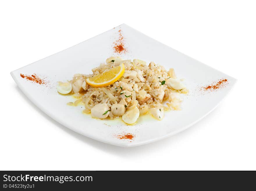 Rice with seafood and quail eggs on a white background