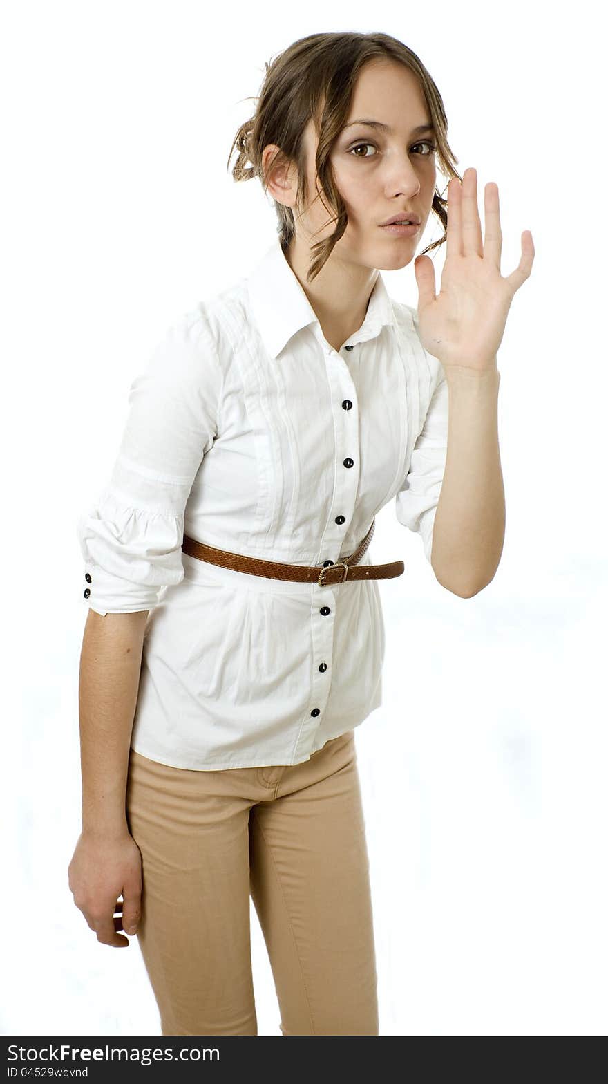 Profile view of a young woman gesturing a verbal call against white background. Profile view of a young woman gesturing a verbal call against white background