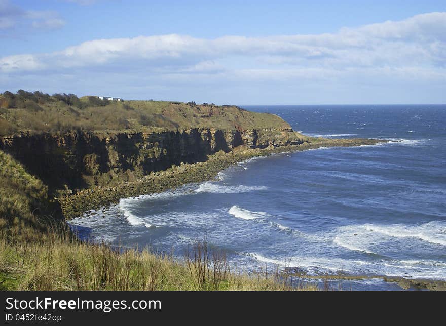 Coastal bay at Cove with cliffs