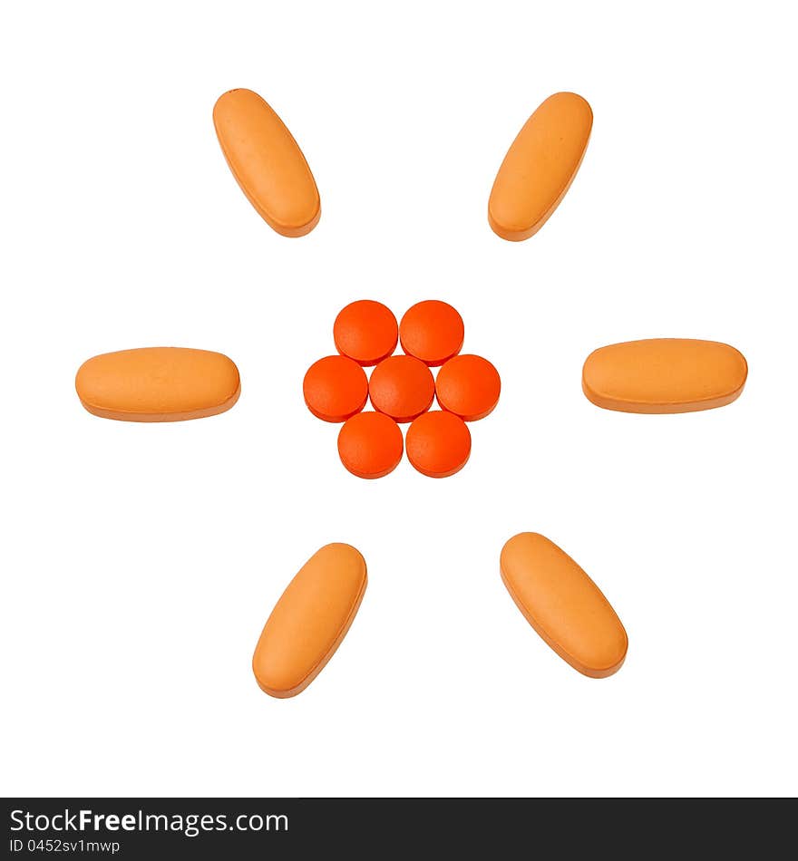 Orange pills in circular pattern.