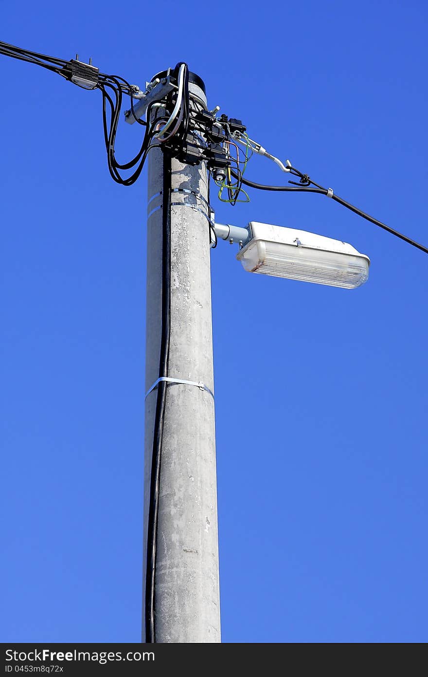 Concrete post with lamp