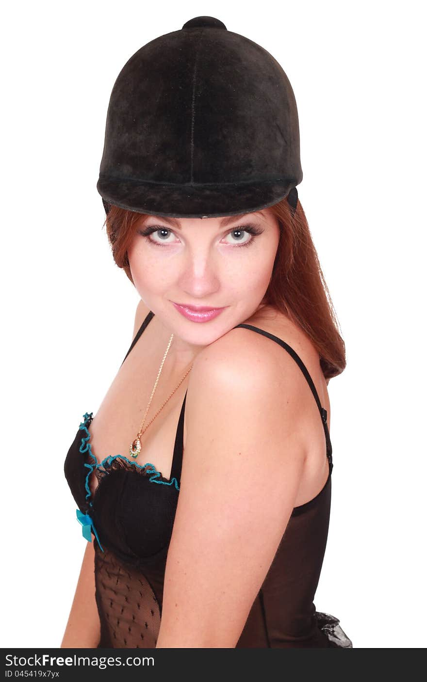 young woman in black lingerie in cap for the rider over white background. young woman in black lingerie in cap for the rider over white background