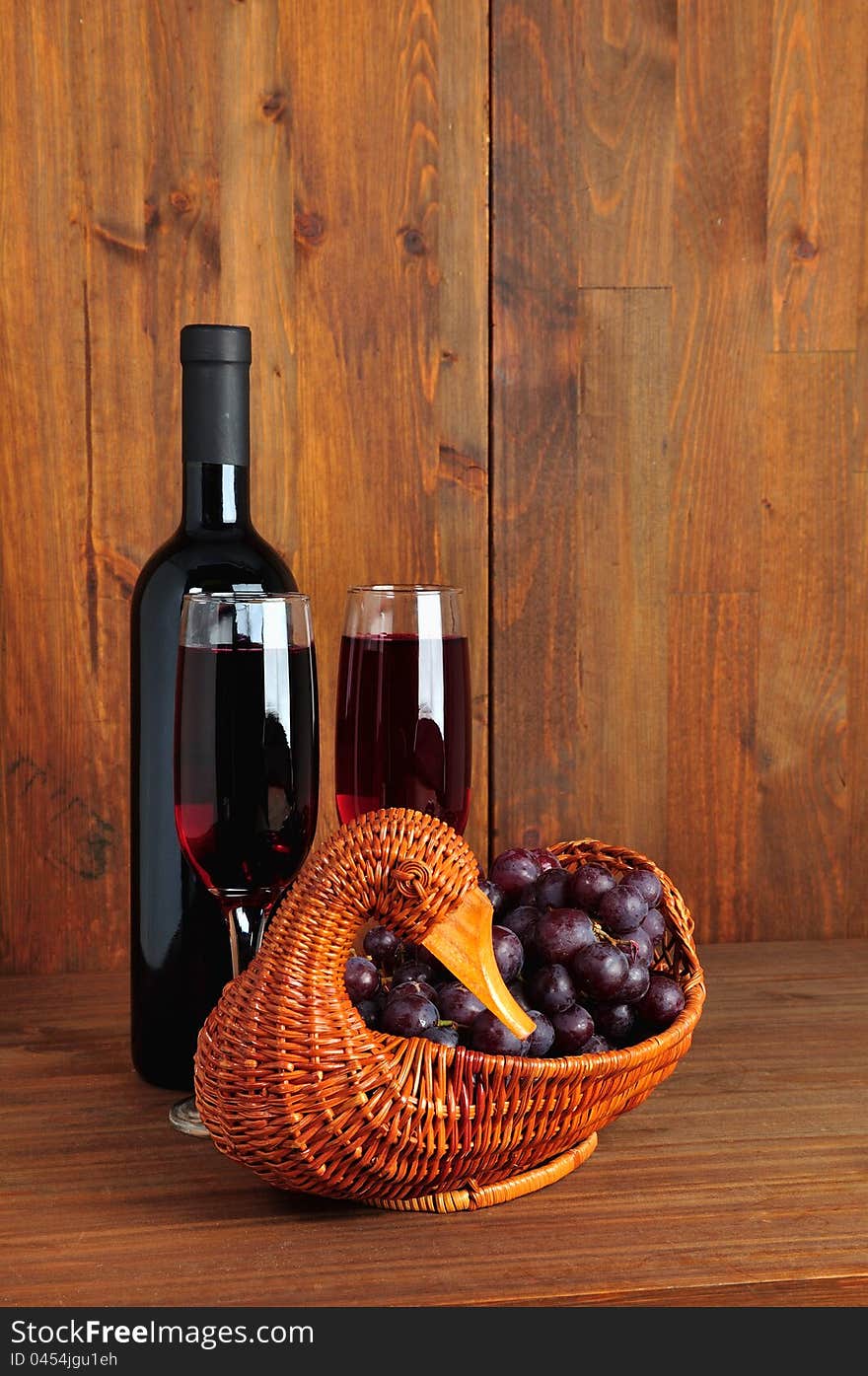 Bottle of read wine with glasses and grapes. Bottle of read wine with glasses and grapes