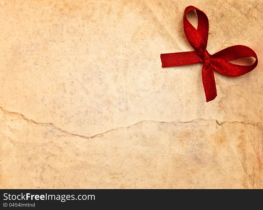 Retro brown paper with red bow. Retro brown paper with red bow