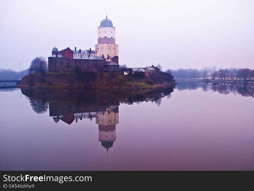 The Vyborg castle with a tower of St.Olav on the island surrounded with a gulf. The Vyborg castle with a tower of St.Olav on the island surrounded with a gulf