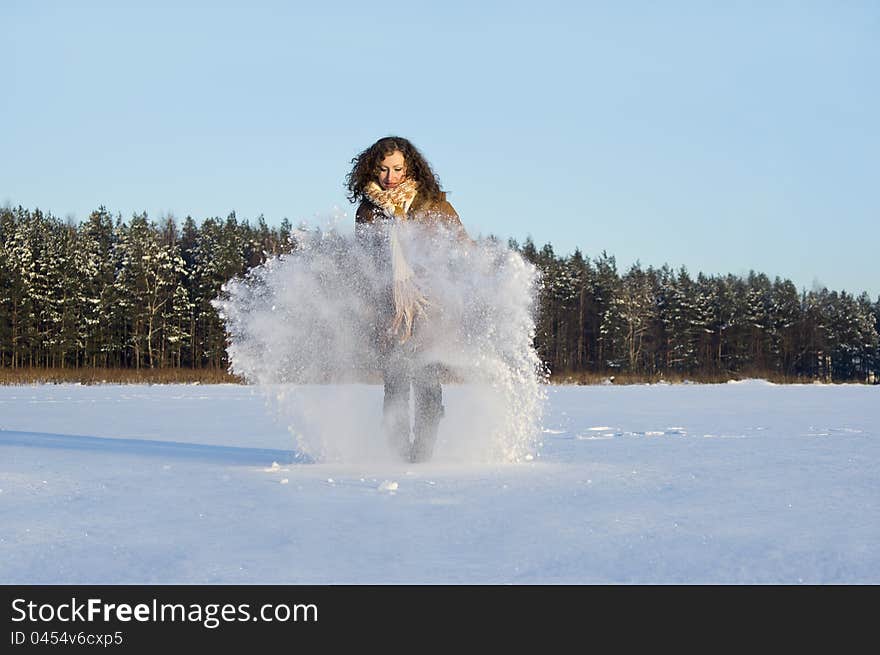 In winter the snow plays a curly-haired girl