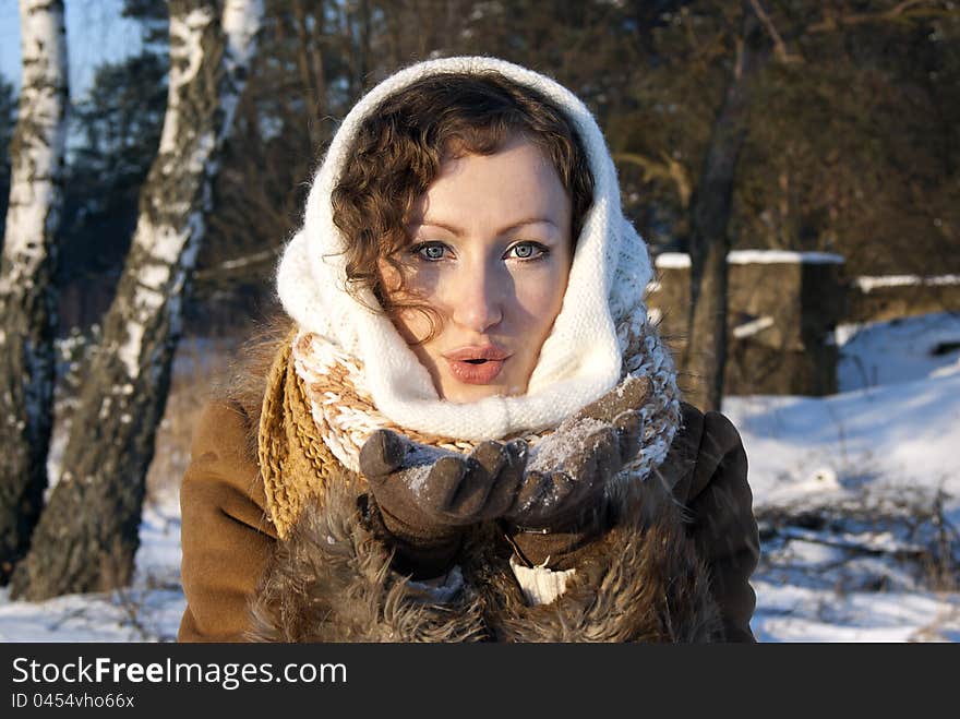 Snow In The Hands Holding The Girl