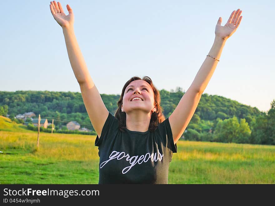 Young beautiful woman enjoying nature