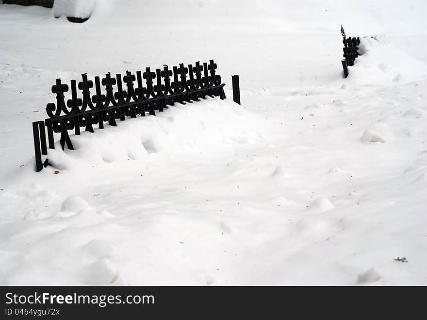 Fence covered in snow