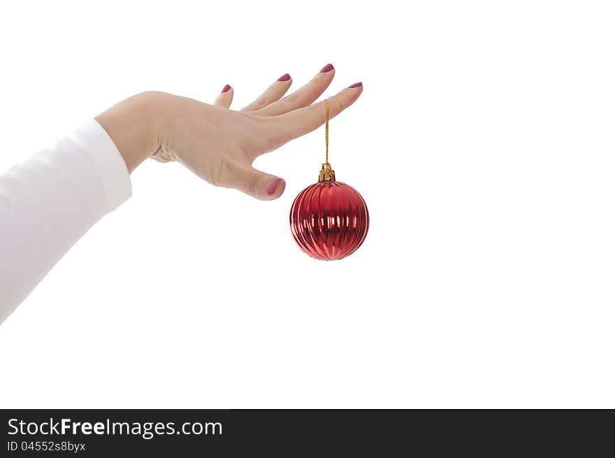 Female hands hold fur-tree spheres on a white background