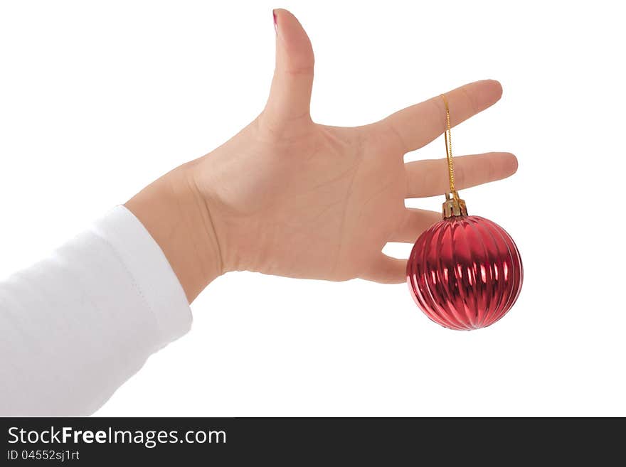 Female hands hold fur-tree spheres on a white background