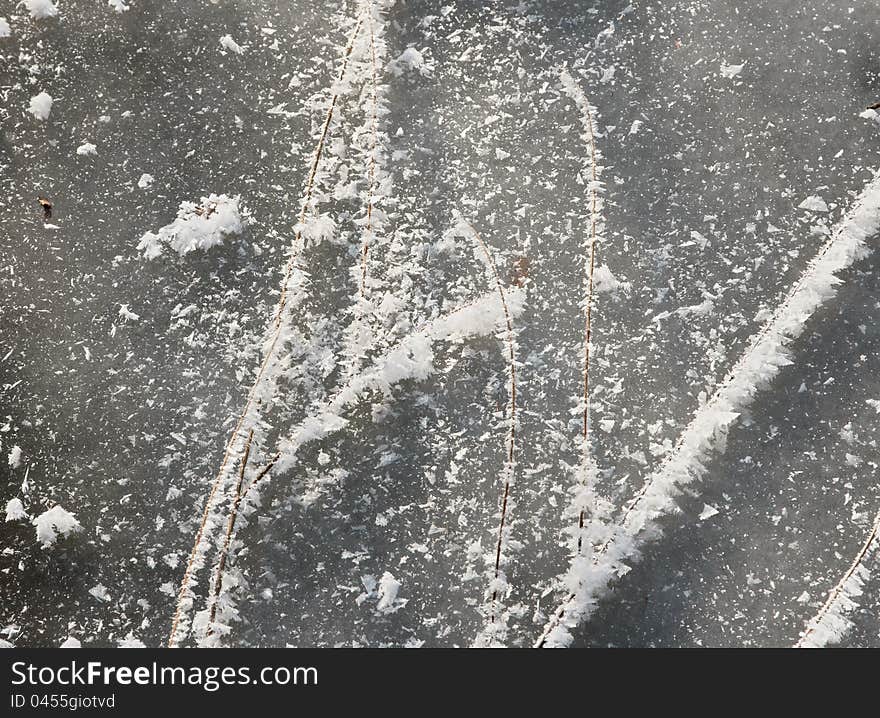 Snowflakes Over Ice And Rods