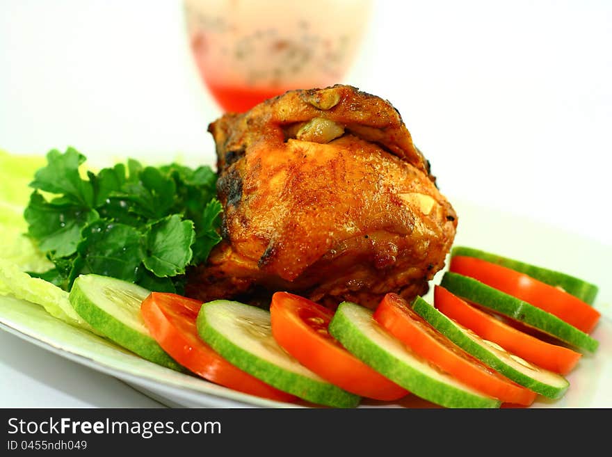 Roasted chicken with vegetables on white background. Roasted chicken with vegetables on white background