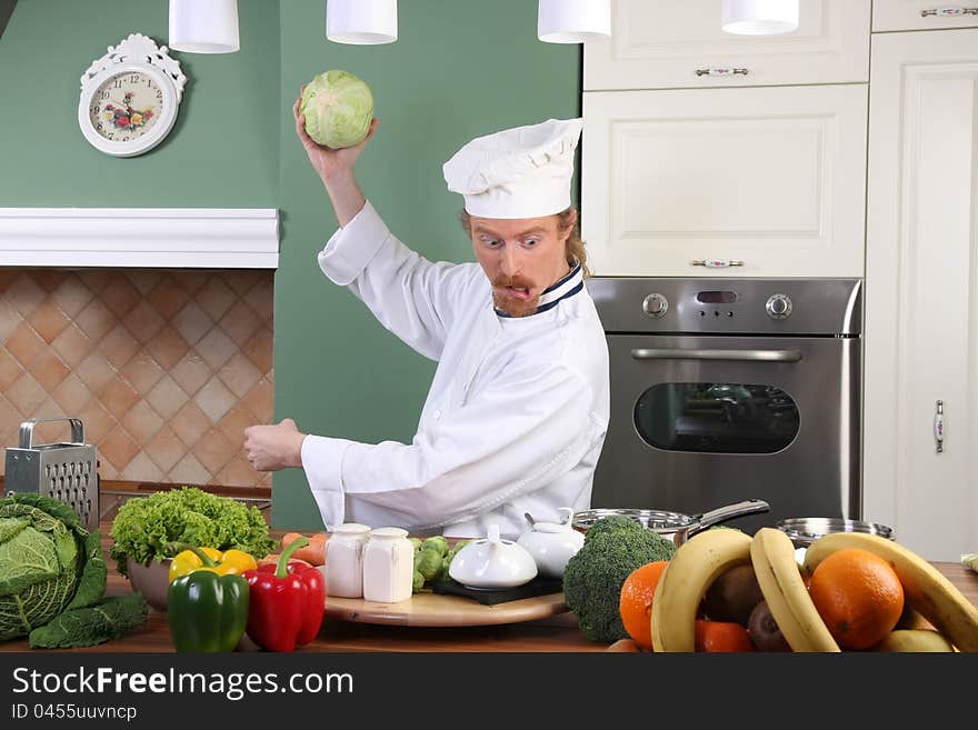 Young Chef Preparing Lunch In Kitchen