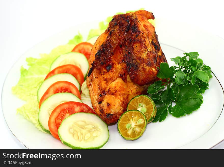 Roasted chicken with vegetables on white background. Roasted chicken with vegetables on white background