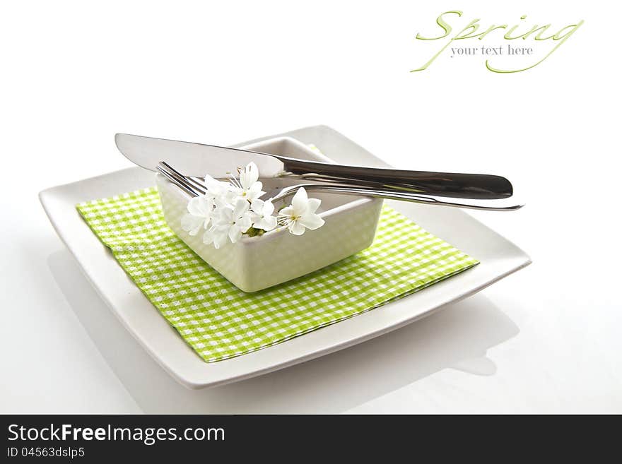 Spring table setting on white with space for text