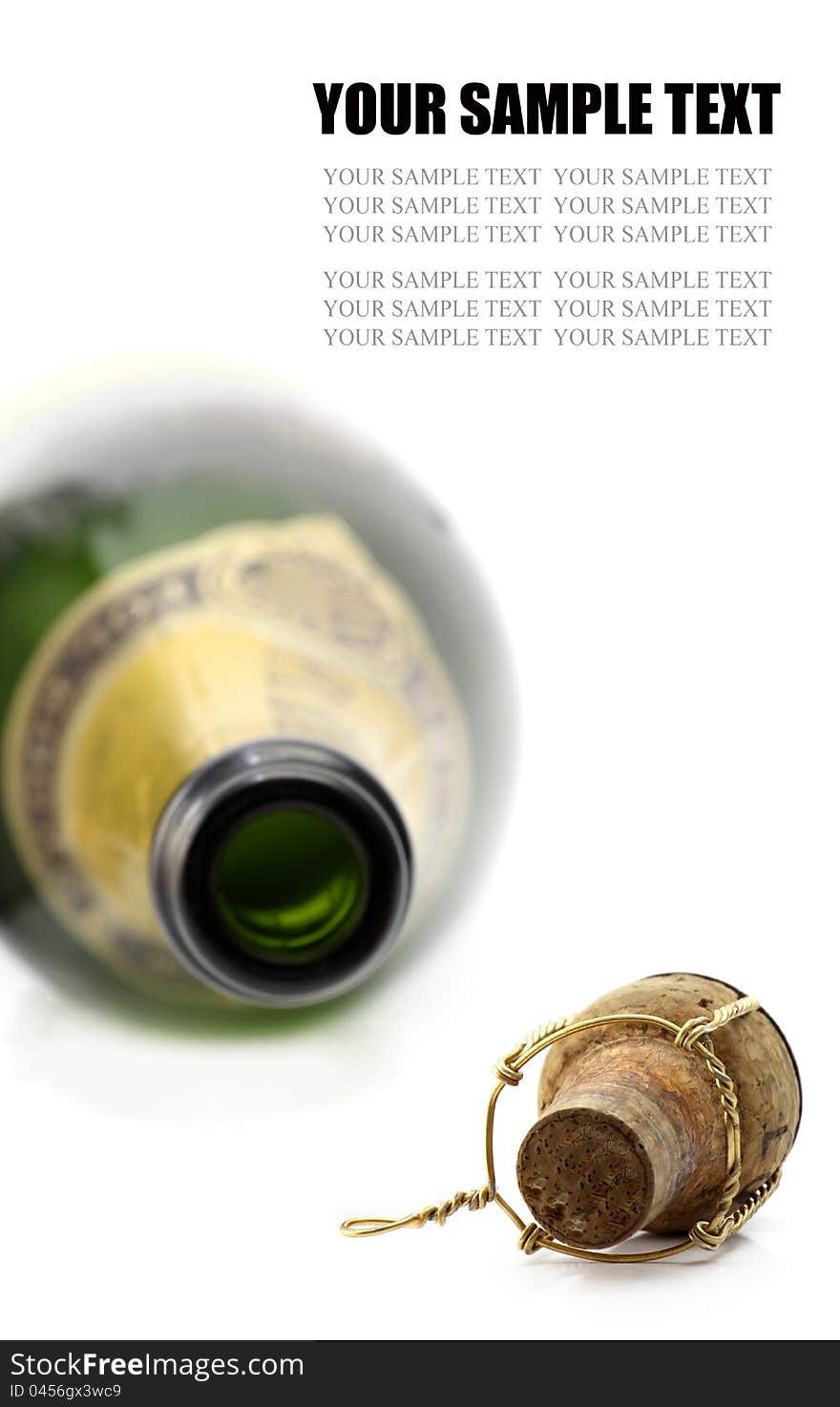 Cork and bottle of champagne on white background