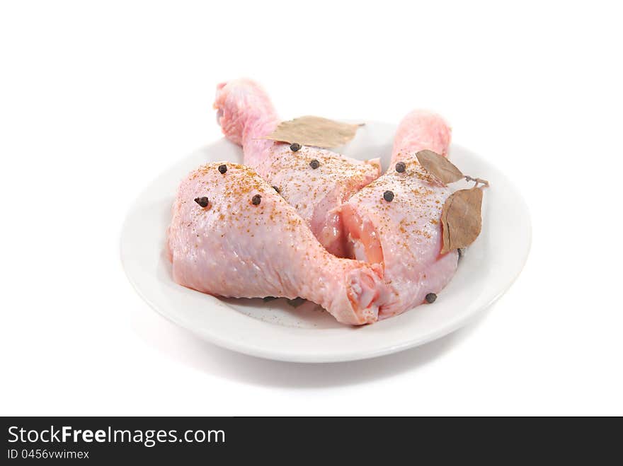 Three fresh raw chicken legs