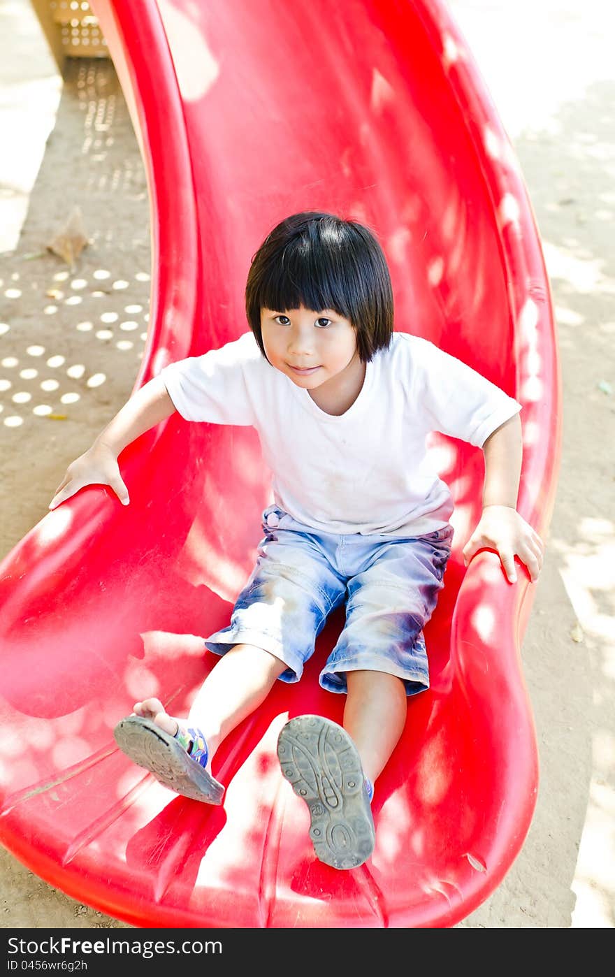 Little Asian girl play in playgound