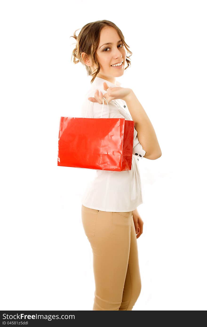 Girl going home carrying shopping bags on her shoulder with happy expression. Girl going home carrying shopping bags on her shoulder with happy expression