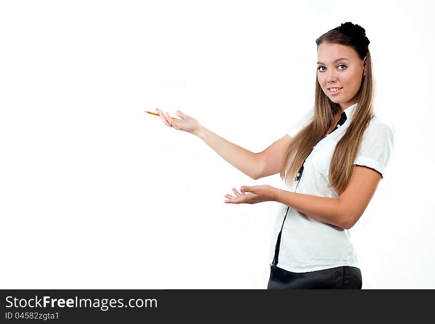 Portrait of a beautiful young woman holding pencil and showing an empty space isolated on white background. Portrait of a beautiful young woman holding pencil and showing an empty space isolated on white background