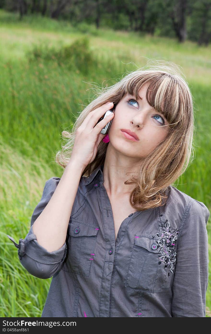 Schoolgirl speaks by mobile phone