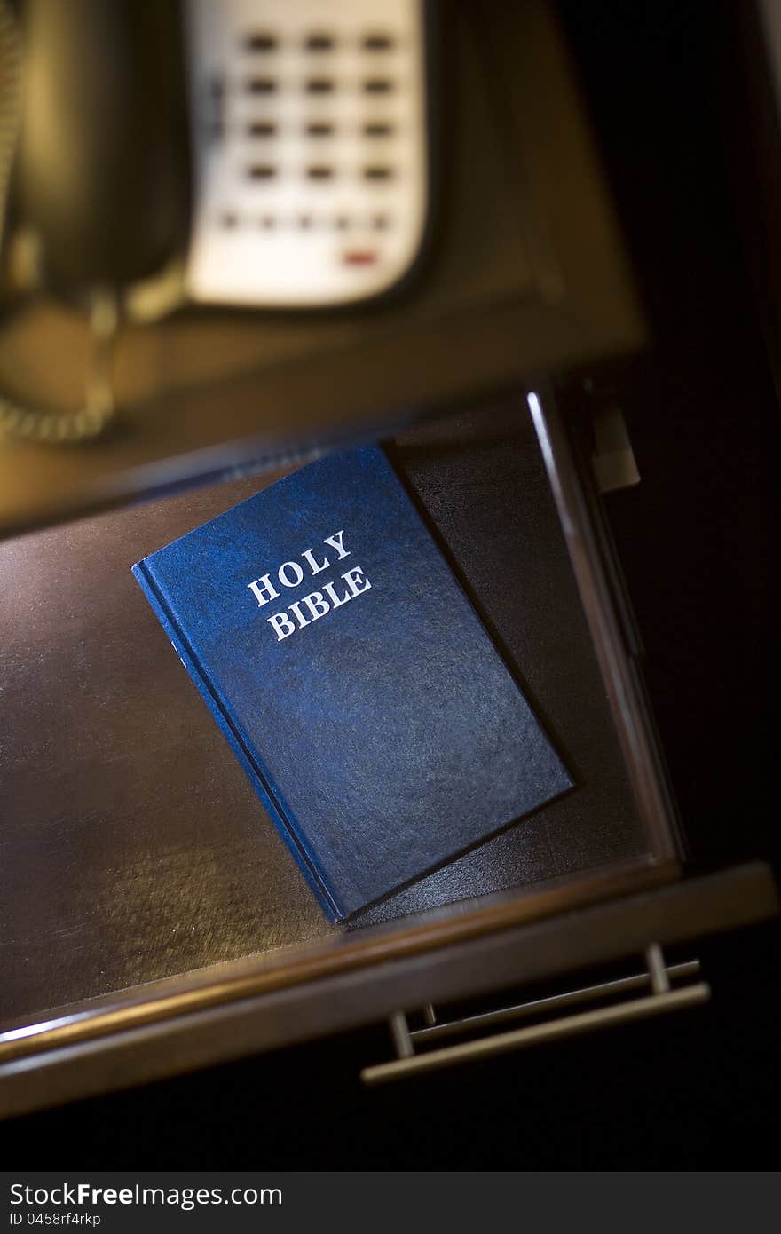 Vertical photograph of a Bible placed in a hotel room. Vertical photograph of a Bible placed in a hotel room