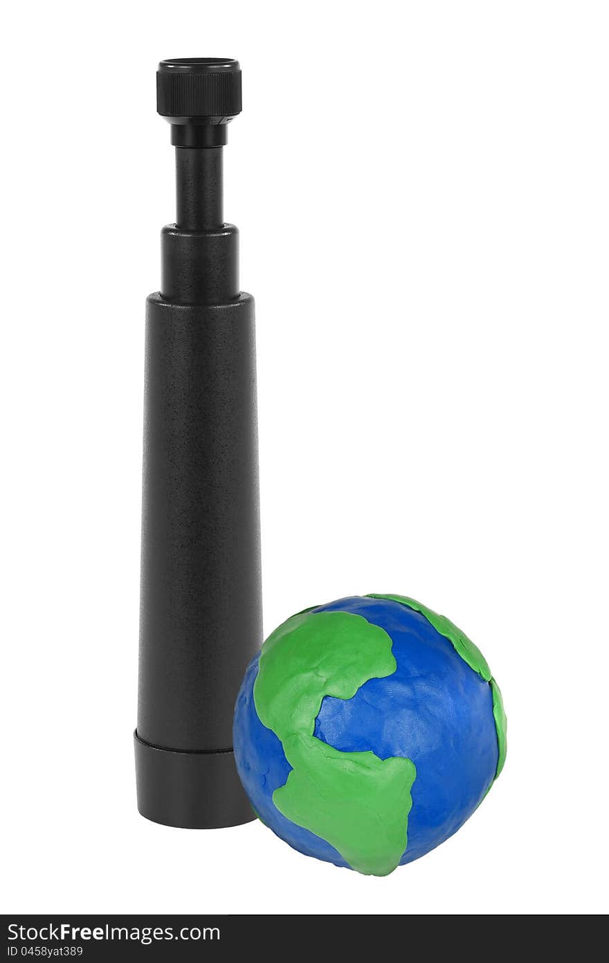 Black telescope and white plasticine Globe. Black telescope and white plasticine Globe