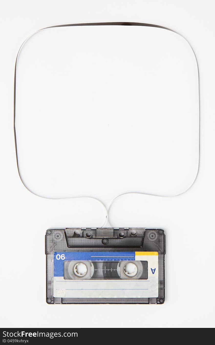 Close up of vintage audio tape on white background