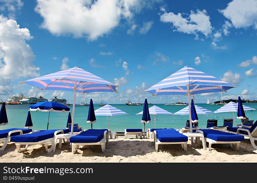 Chairs and umbrellas at the beach. Chairs and umbrellas at the beach