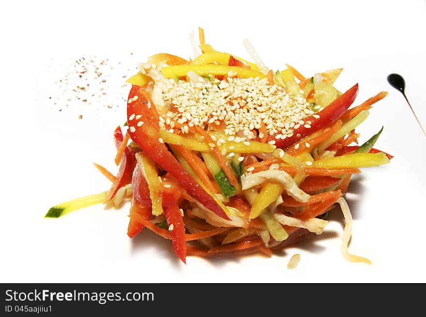 Salad with peppers onions and tomatoes called a white plate