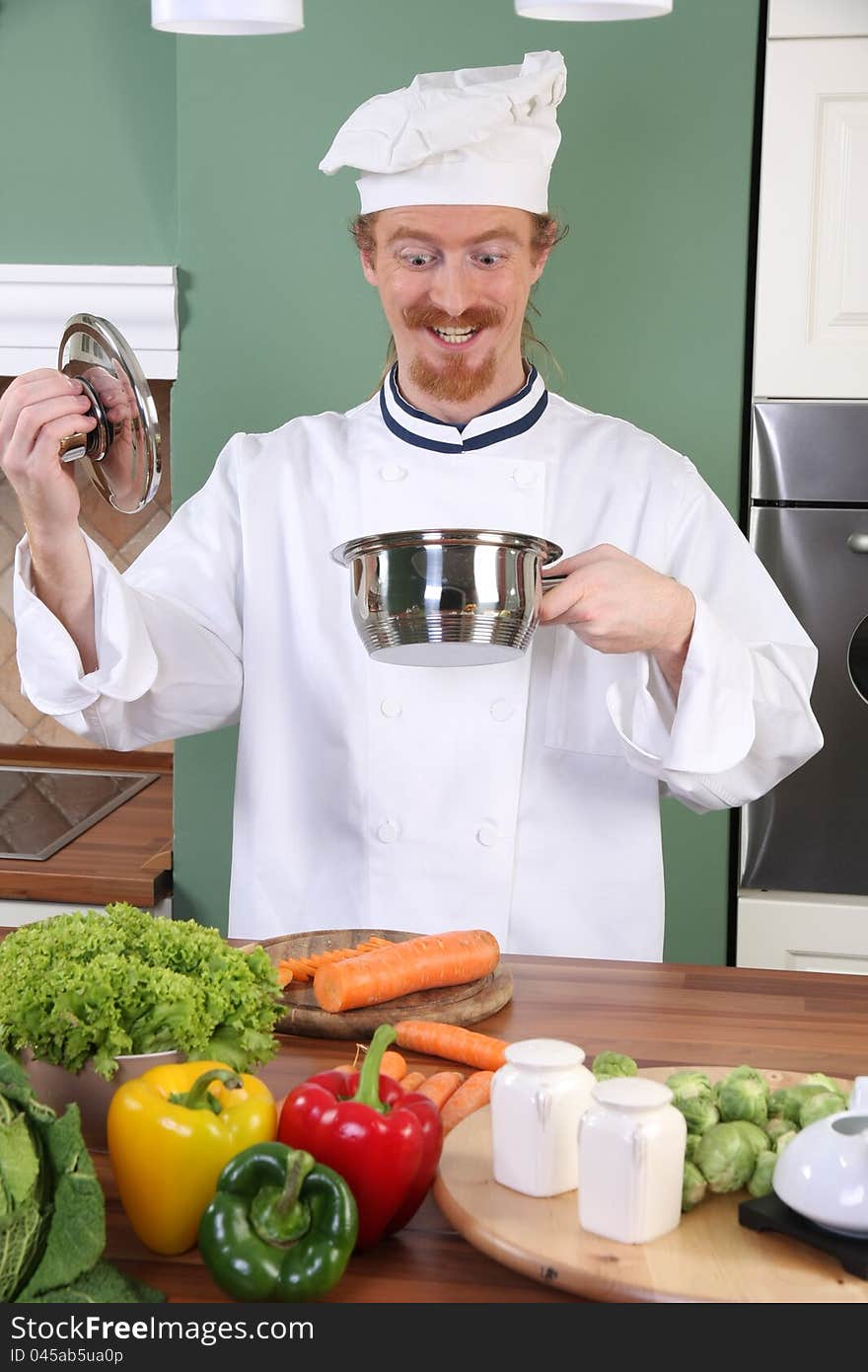 Funny young chef strange looking at pot