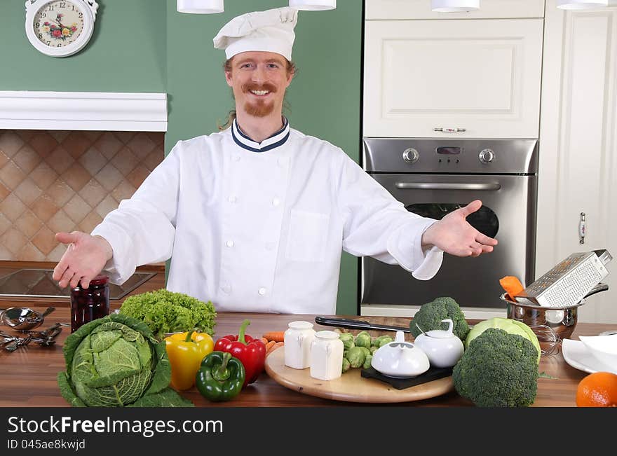 Young chef preparing lunch in kitchen