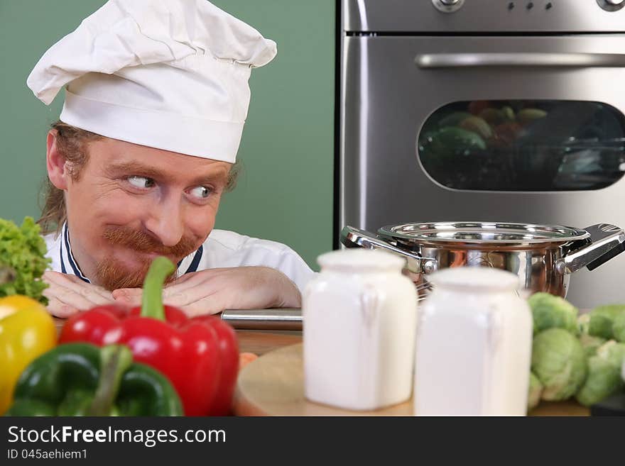 Young Chef Preparing Lunch In Kitchen