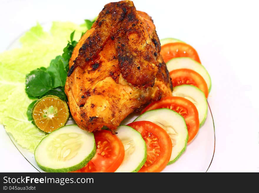 Roasted chicken with vegetables on white background. Roasted chicken with vegetables on white background