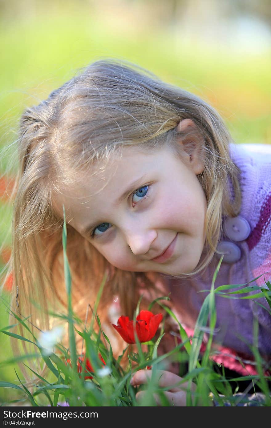 Portrait of blond child outside in nature