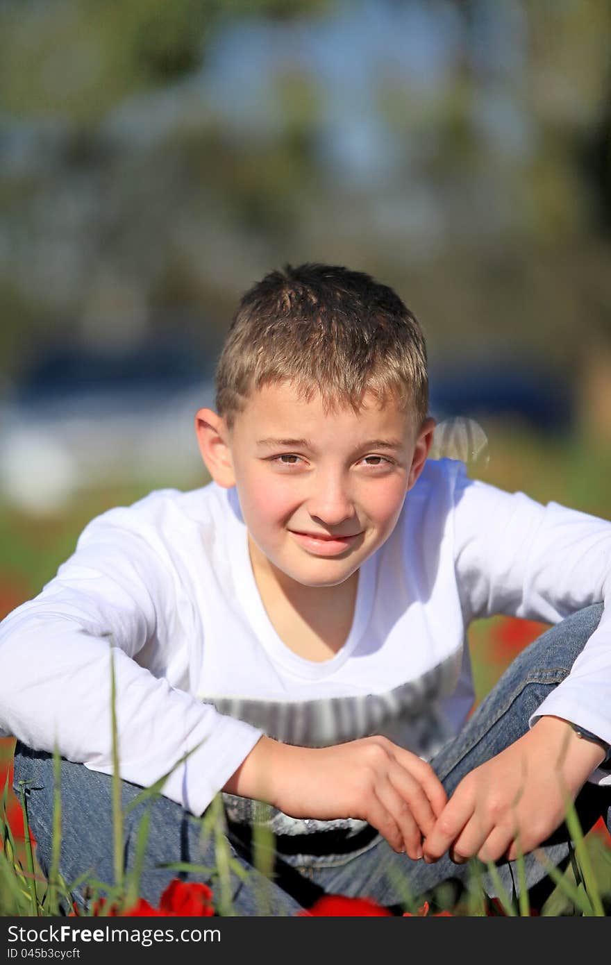 Portrait of a boy outside on the nature of the summer