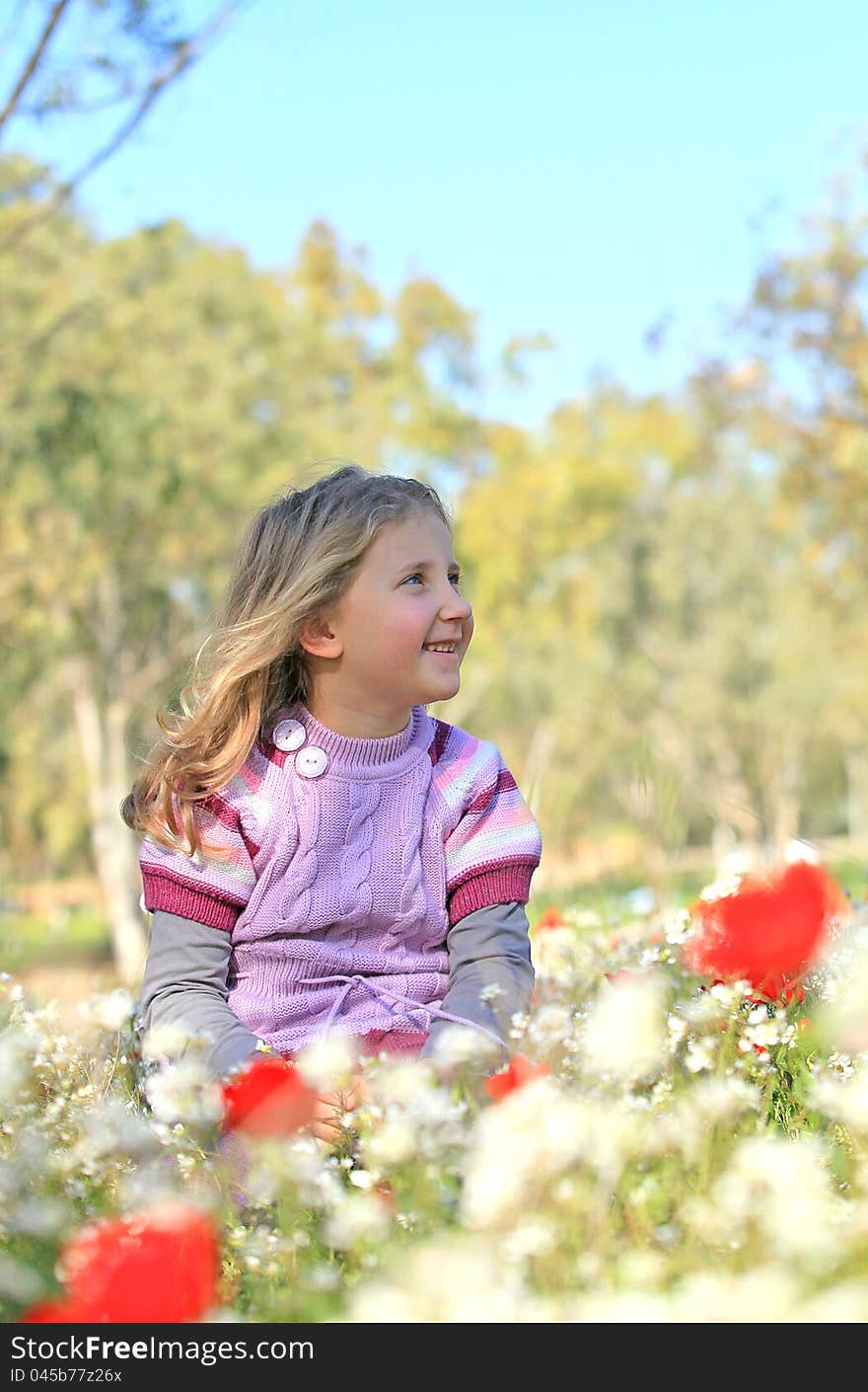 Portrait of a smiling girl on the outside of nature summer