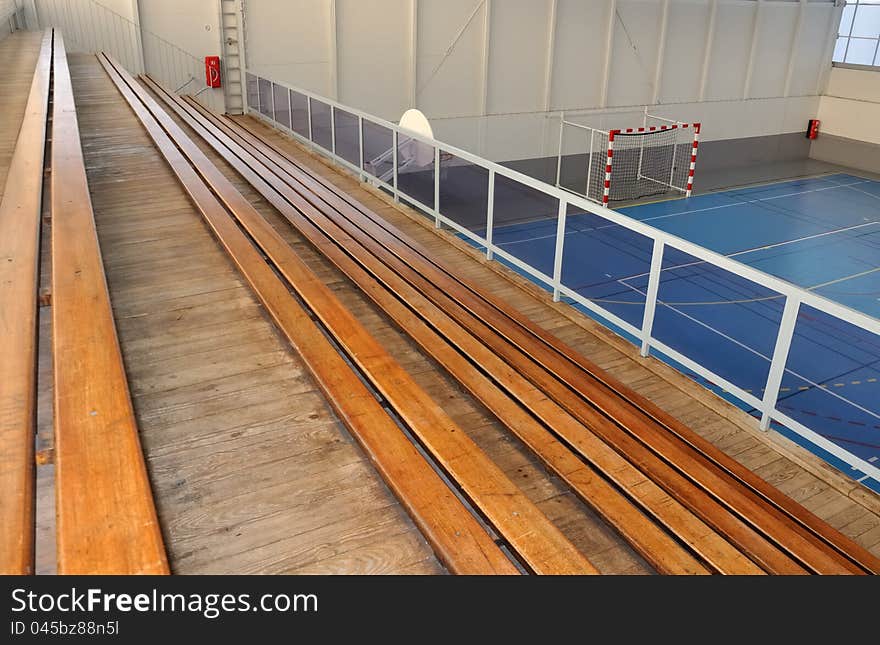 Wooden grandstands all in length in a gymnasium