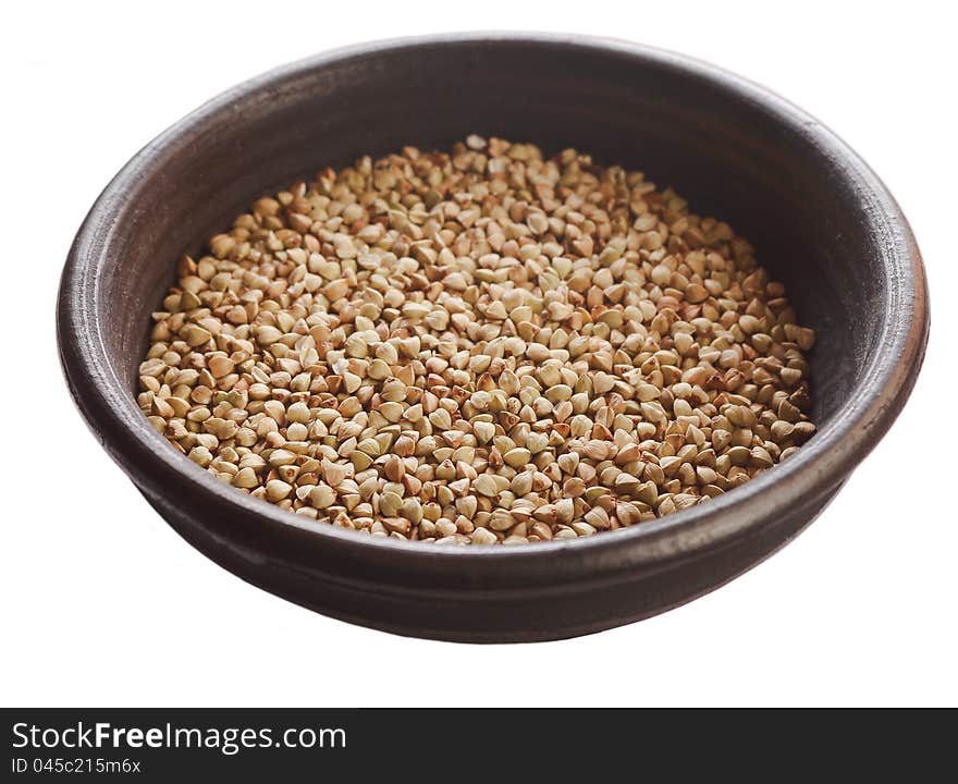 Raw buckwheat isolated on white background