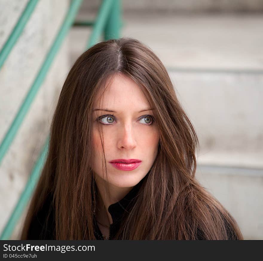 A portrait of a beautiful woman in an urban setting. A portrait of a beautiful woman in an urban setting