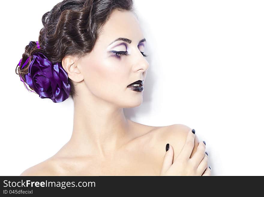 Beauty and health, cosmetics and makeup. Portrait of fashion woman model with bright purple makeup, curly hairstyle on light white background. Beauty and health, cosmetics and makeup. Portrait of fashion woman model with bright purple makeup, curly hairstyle on light white background.