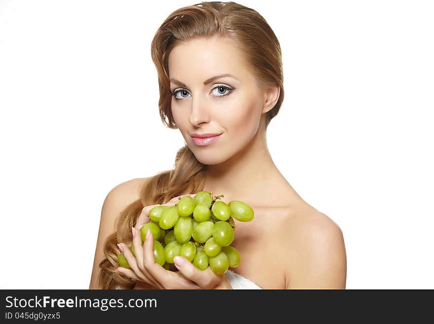 Beautiful  woman holding a bunch of grape