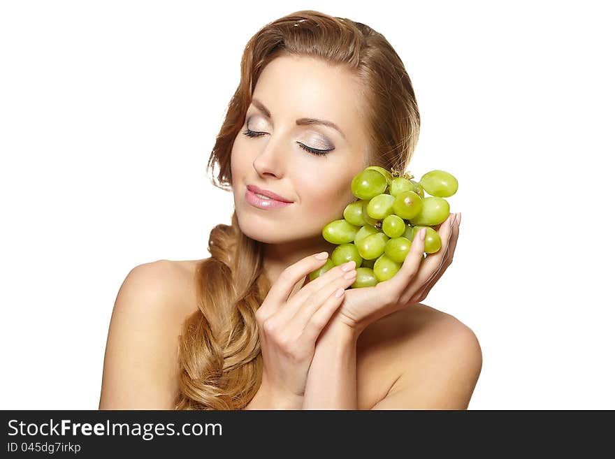 Smiling beautiful  woman holding a bunch of grape