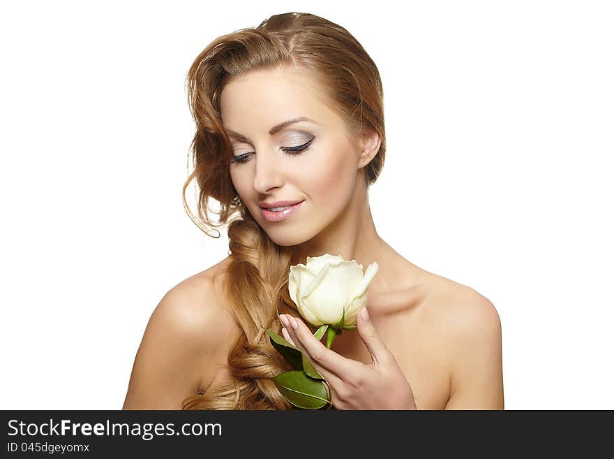 Smiling beautiful woman with white rose